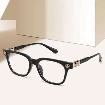 A pair of black square-frame glasses on a pale stand
